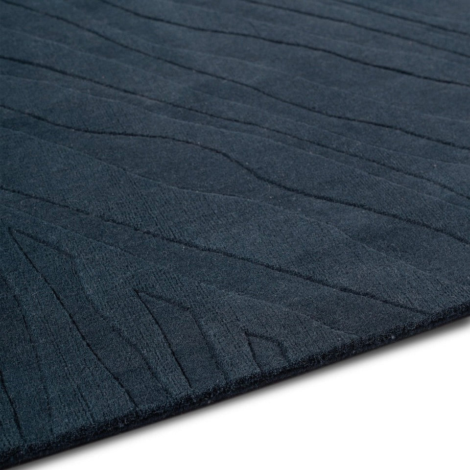 RUGKARI Reverie solid pure New Zealand wool luxury rug styled in an Indian living room - image 4