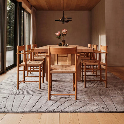 RUGKARI Nautilus solid pure New Zealand wool luxury rug styled in an Indian living room - image 2