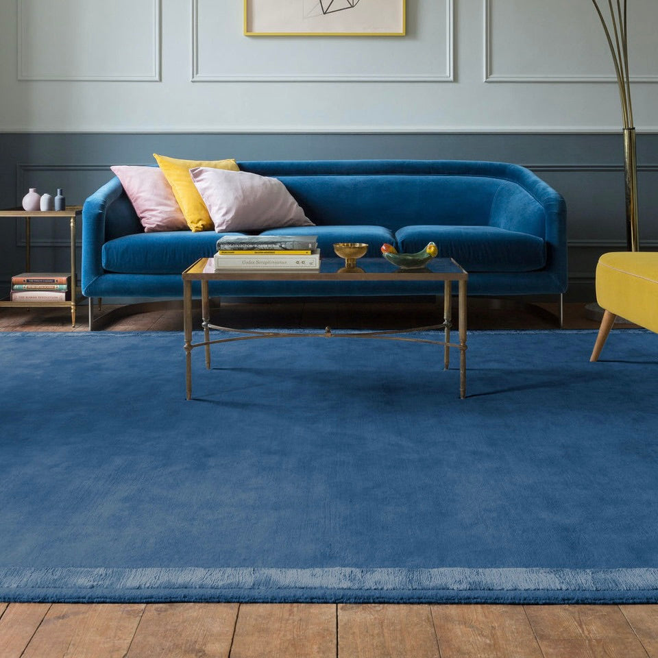 RUGKARI Inkwell solid pure New Zealand wool luxury rug styled in an Indian living room - image 2