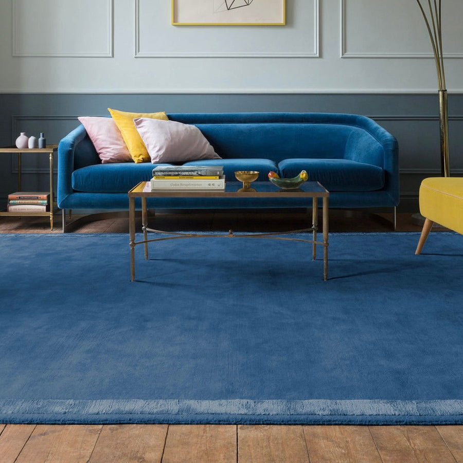 RUGKARI Inkwell solid pure New Zealand wool luxury rug styled in an Indian living room - image 2