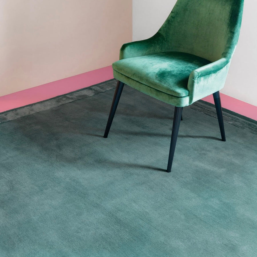 RUGKARI Verdant solid pure New Zealand wool luxury rug styled in an Indian living room - image 2