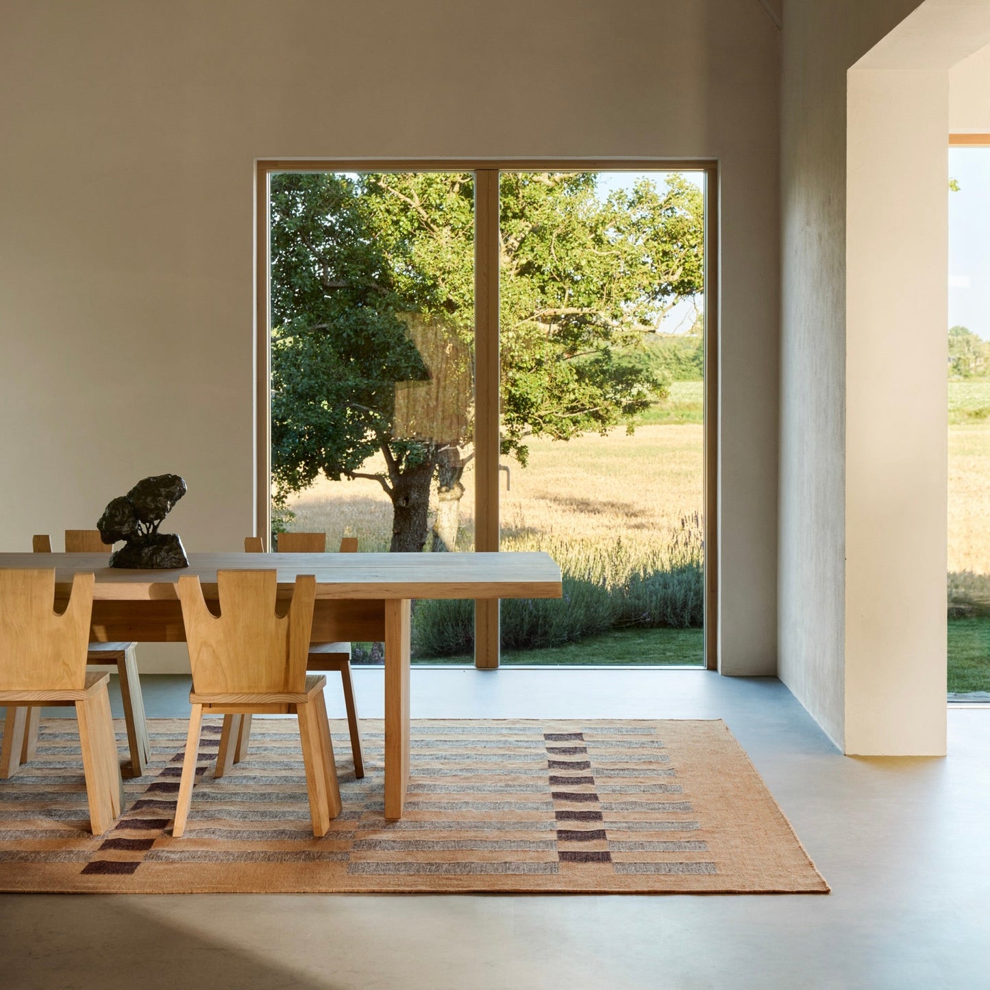 RUGKARI Chronos geometric pure New Zealand wool luxury rug styled in an Indian living room - image 2