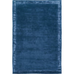 RUGKARI Inkwell solid pure New Zealand wool luxury rug styled in an Indian living room - image 1