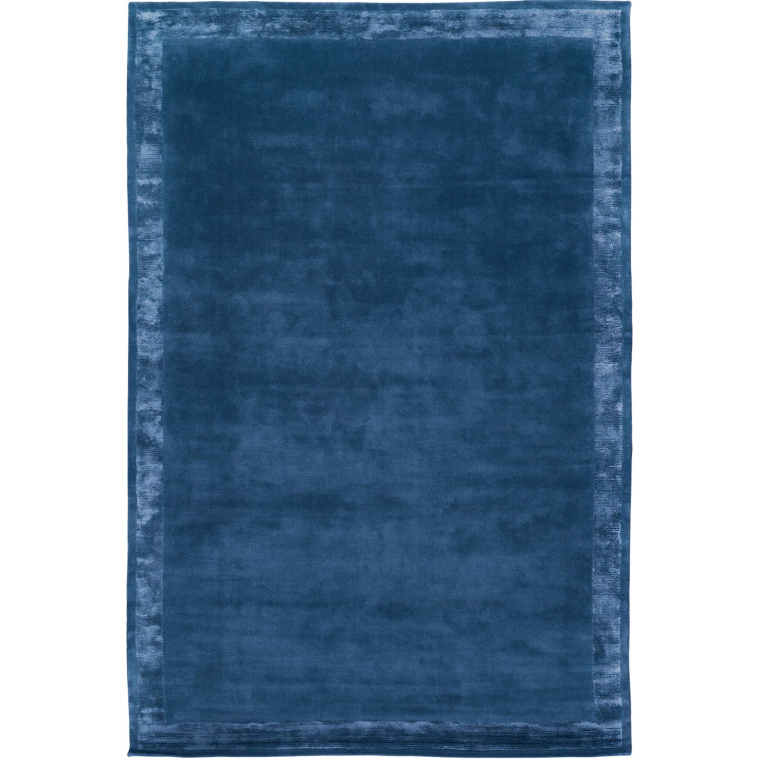 RUGKARI Inkwell solid pure New Zealand wool luxury rug styled in an Indian living room - image 1