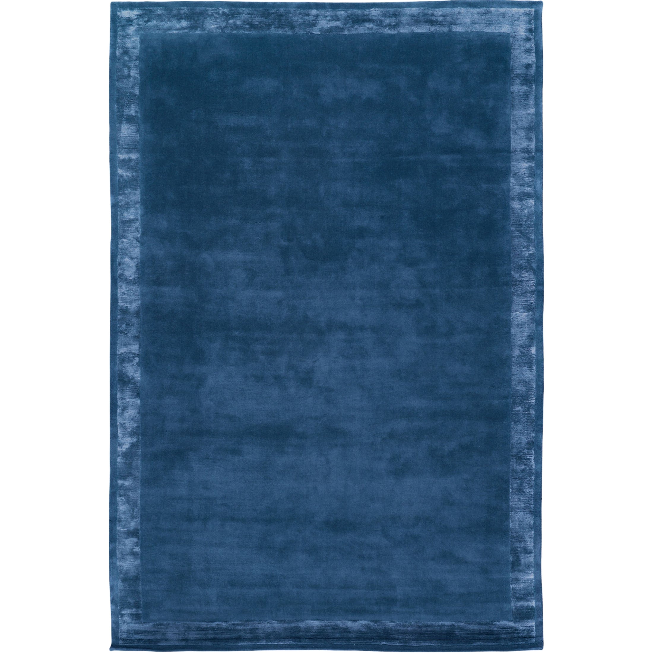 RUGKARI Inkwell solid pure New Zealand wool luxury rug styled in an Indian living room - image 1