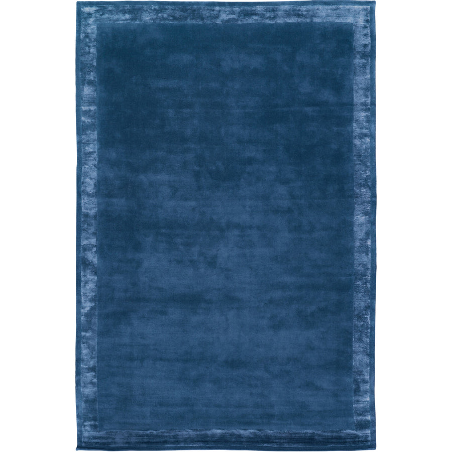 RUGKARI Inkwell solid pure New Zealand wool luxury rug styled in an Indian living room - image 1