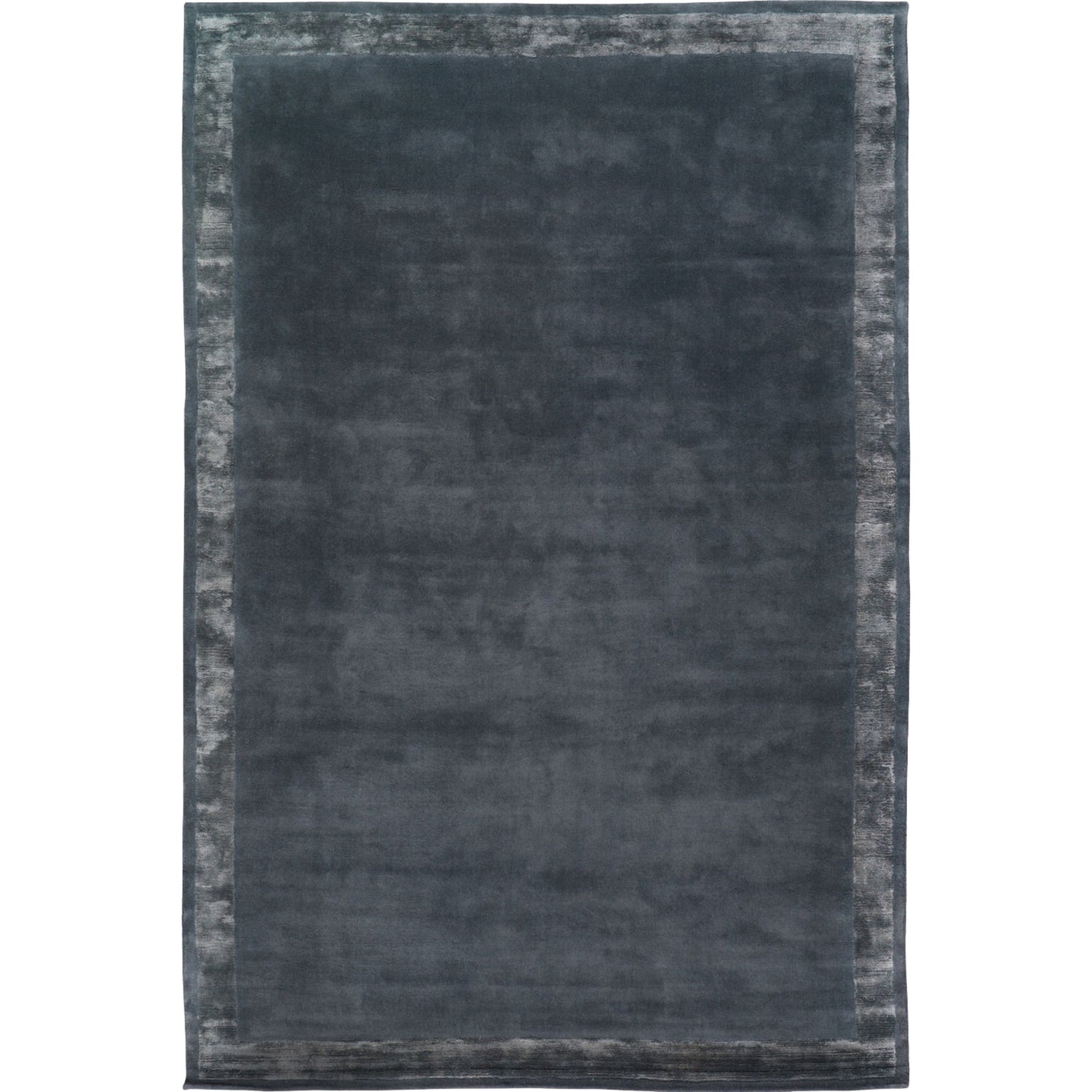 RUGKARI Slate solid pure New Zealand wool luxury rug styled in an Indian living room - image 1