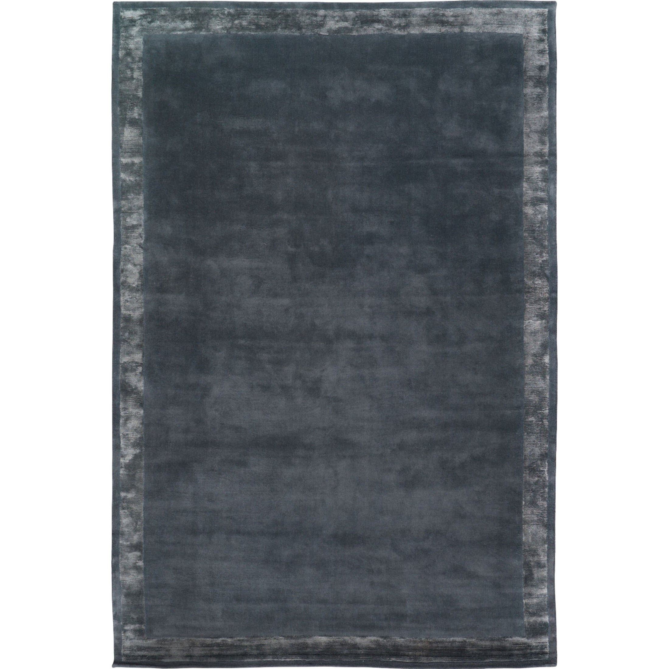 RUGKARI Slate solid pure New Zealand wool luxury rug styled in an Indian living room - image 1