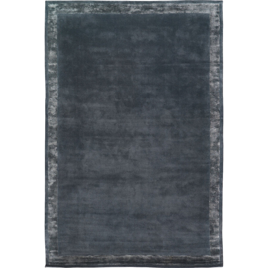 RUGKARI Slate solid pure New Zealand wool luxury rug styled in an Indian living room - image 1