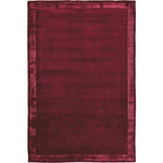 RUGKARI Claret solid pure New Zealand wool luxury rug styled in an Indian living room - image 1