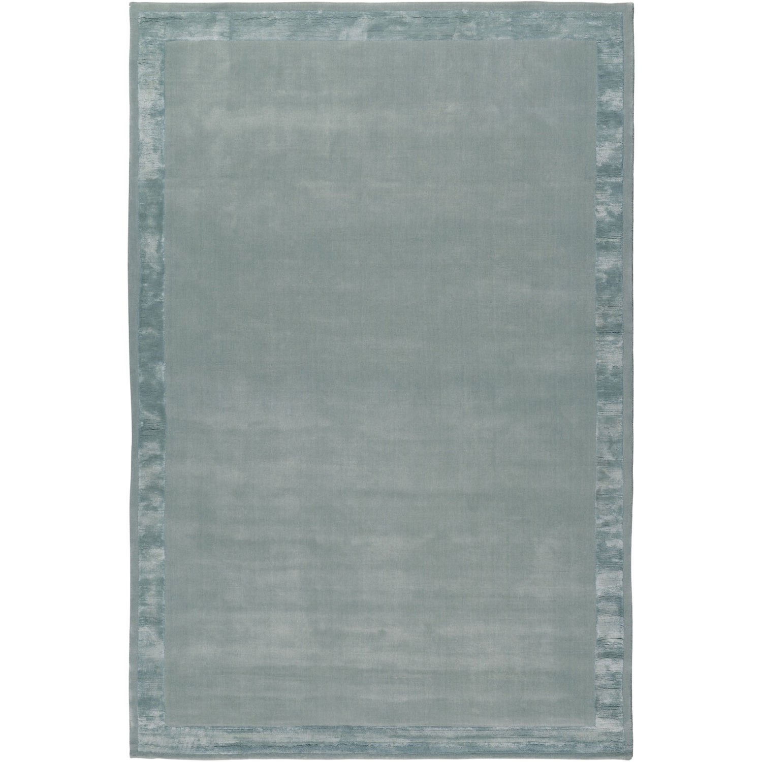 RUGKARI Haze solid pure New Zealand wool luxury rug styled in an Indian living room - image 1