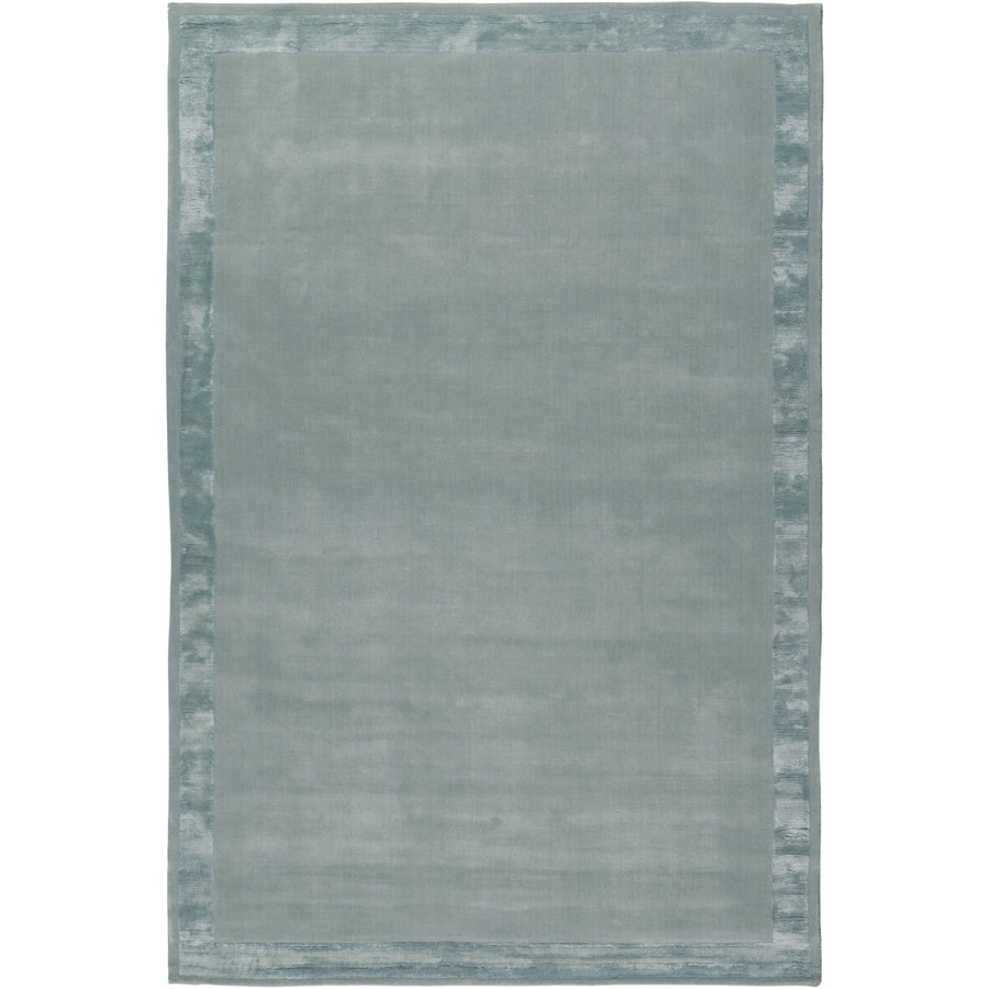 RUGKARI Haze solid pure New Zealand wool luxury rug styled in an Indian living room - image 1